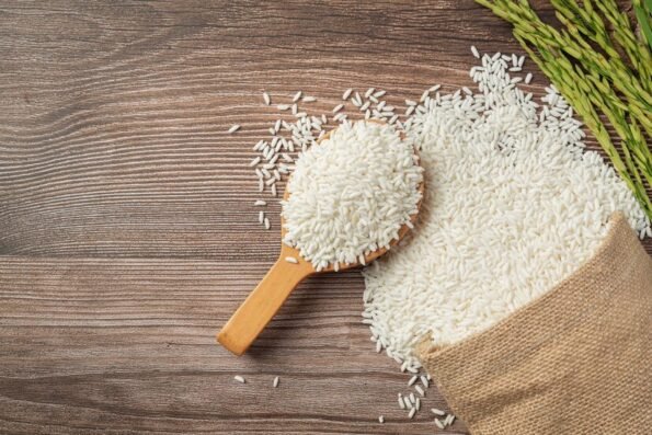 sack-rice-with-rice-wooden-spoon-rice-plant_1150-34315